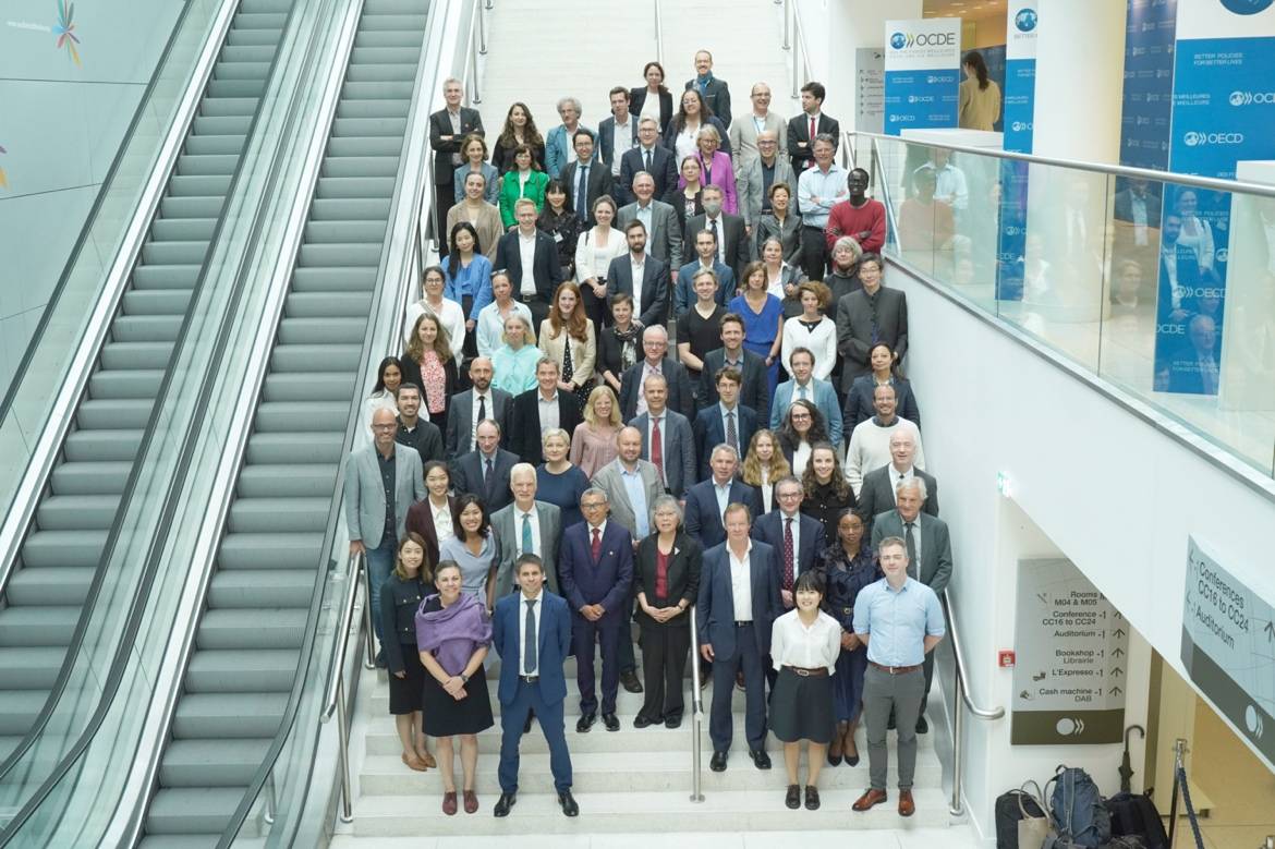 A group of people standing on stairsDescription automatically generated